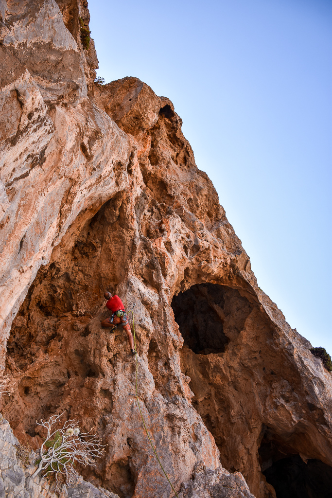 Person rock climbing in Amatou gorge, Xerokampos, east Crete