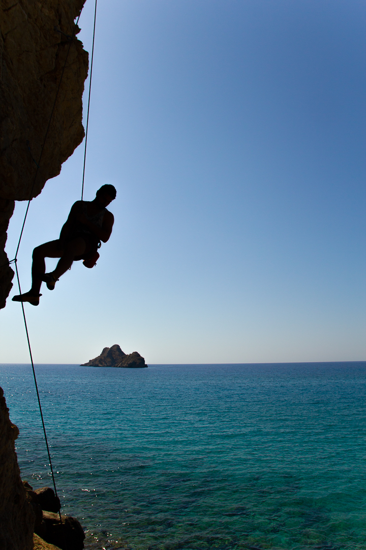 Person hanging on rope at Mazida beach, Xerokampos, east Crete
