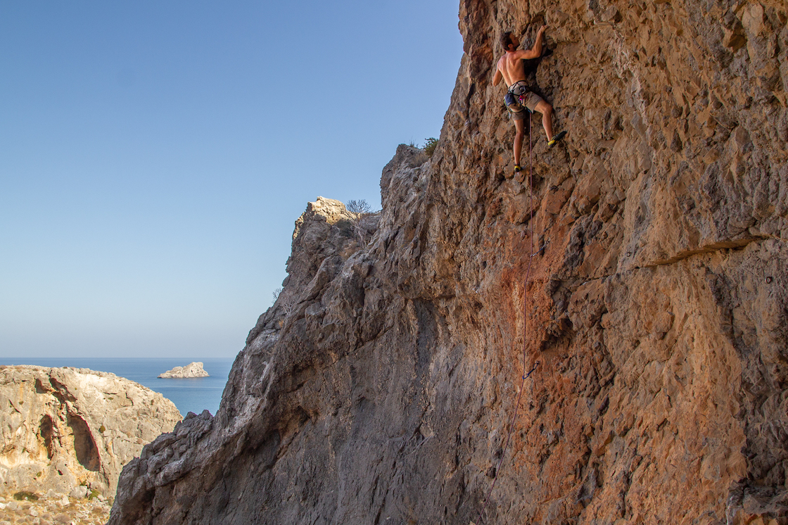 Person rock climbing in Amatou gorge, Xerokampos, east Crete